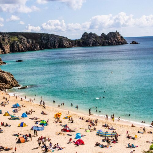 Ariel shot of people on Porthcurno Beach