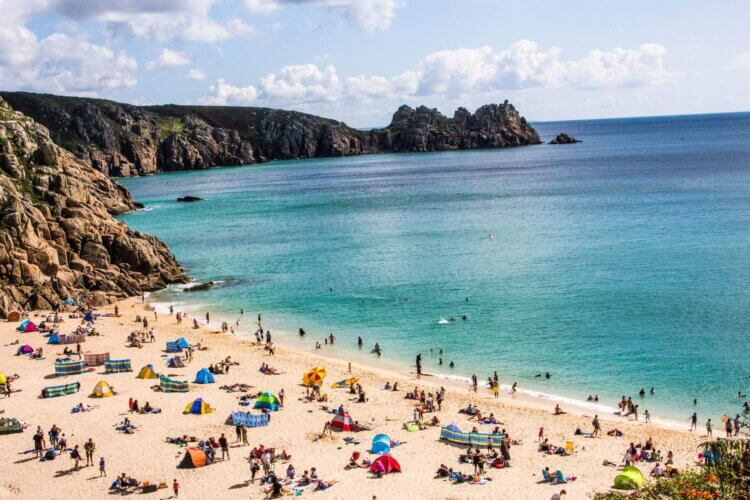 Ariel shot of people on Porthcurno Beach