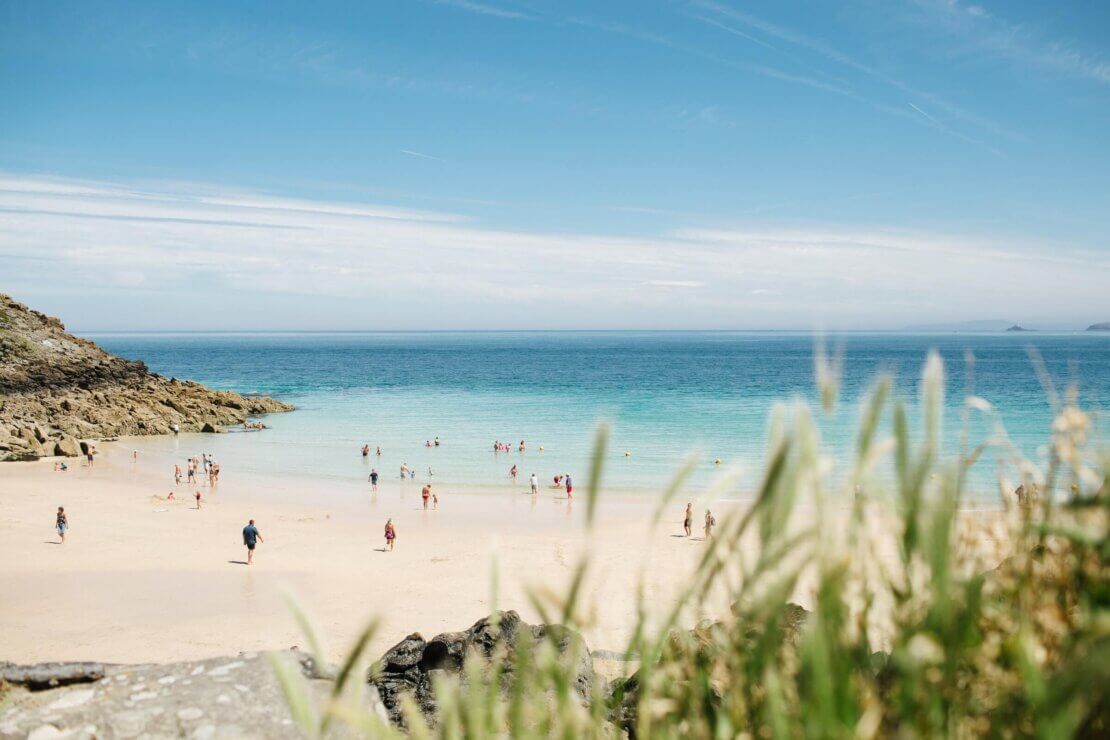 people on st ives beach in the summer