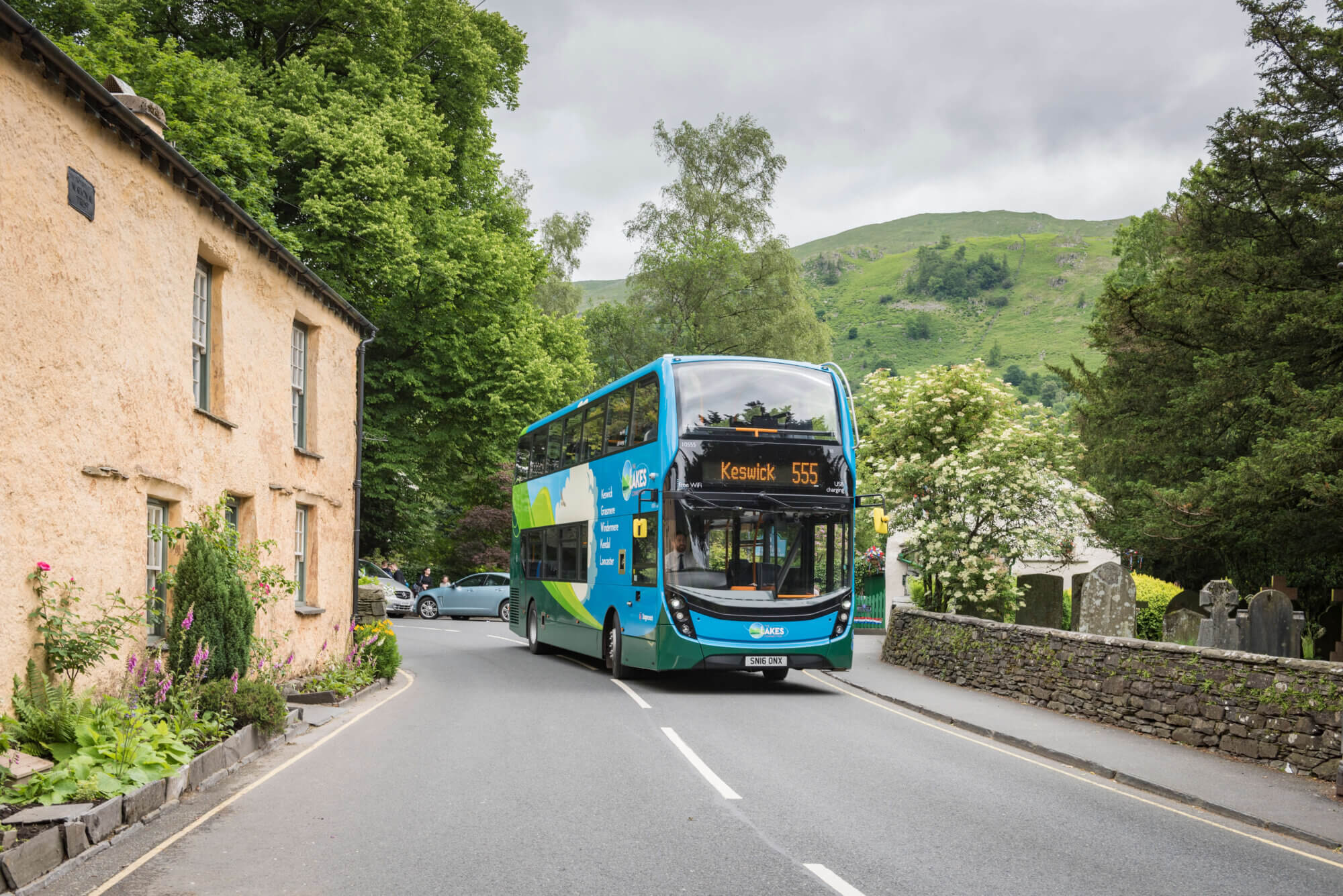 Welcome sign with bus in Keswick