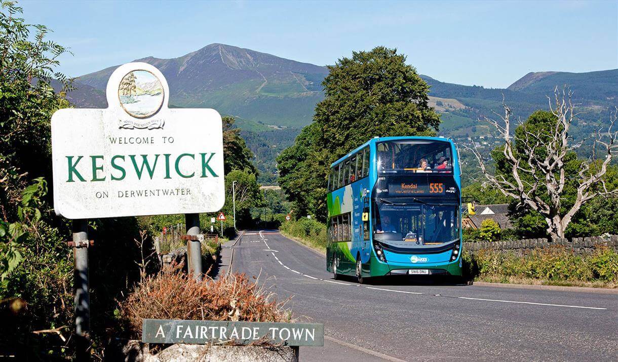 Welcome sign with bus in Keswick